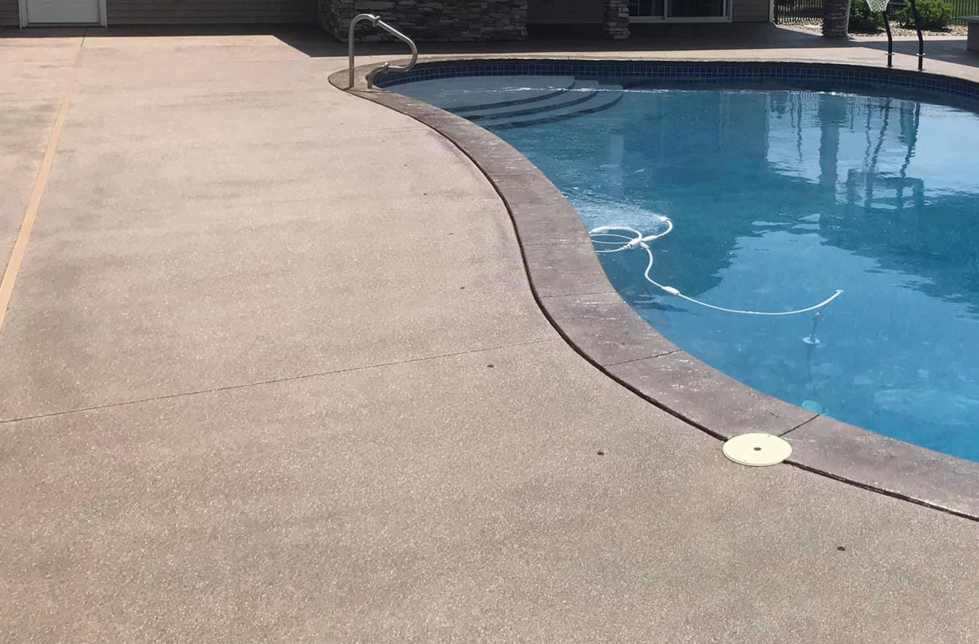 this image shows pool deck in Cypress, California